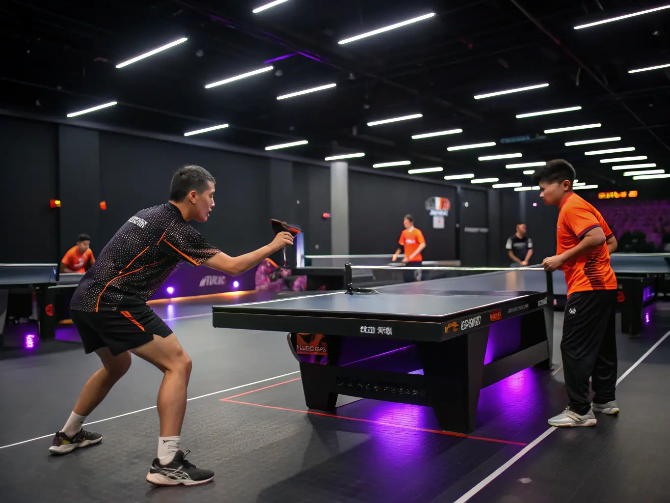 A vibrant image of a table tennis training session in progress, with players of various ages and skill levels engaged in active play, showcasing the inclusive environment of TENNIS DE TABLE AURILLACOIS.