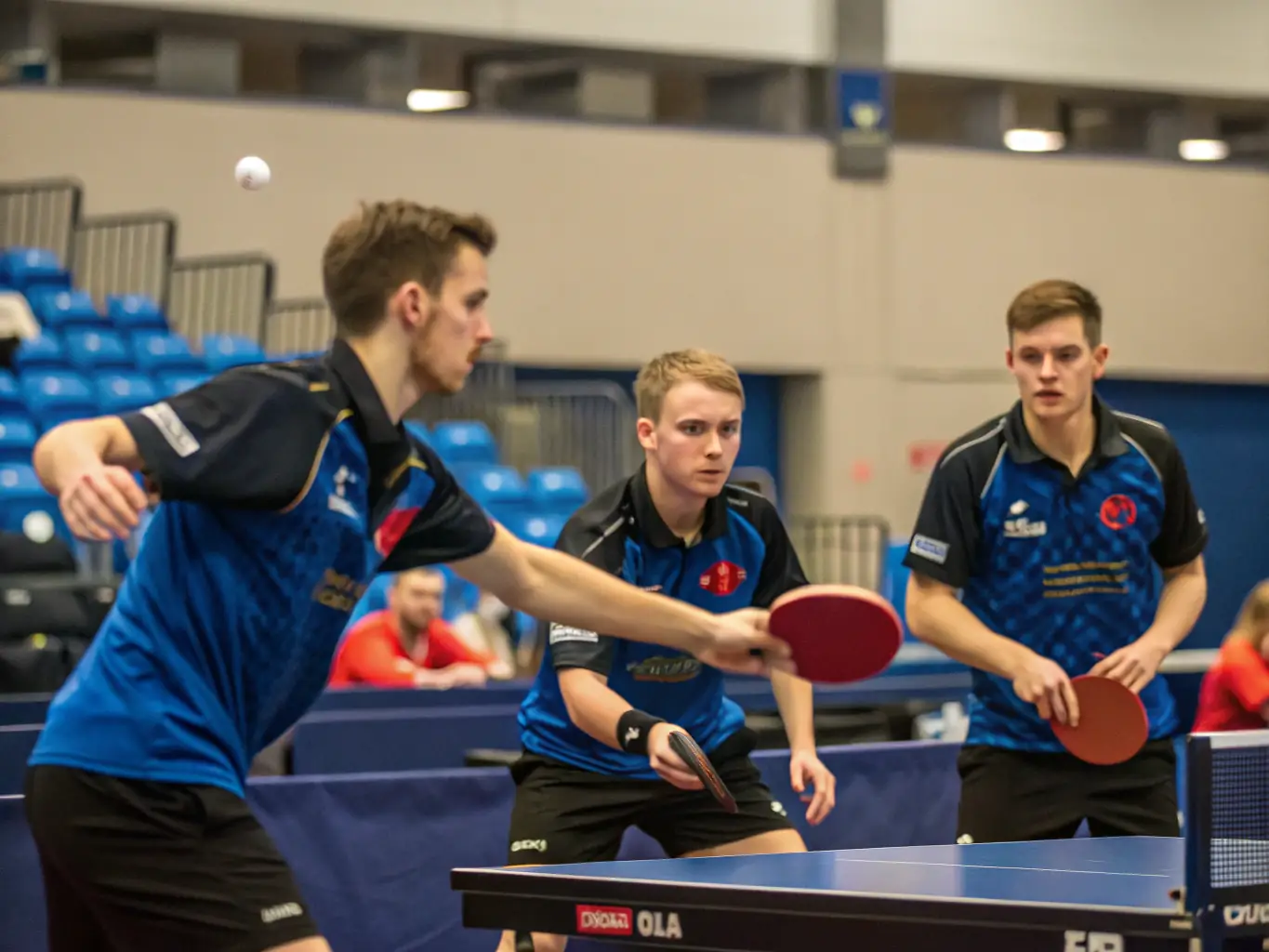 An action shot of a thrilling table tennis tournament organized by TENNIS DE TABLE AURILLACOIS, capturing the excitement and competitive spirit of the event.
